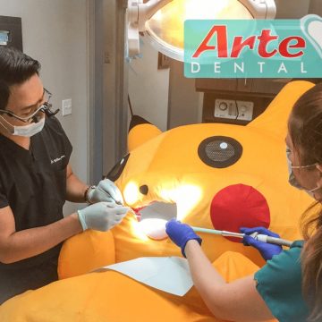 Dr. Nguyen and Team Examining Pikachu at Arte Dental